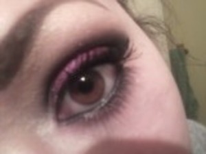 A purple smokey eye with 'cat eye' eyeliner