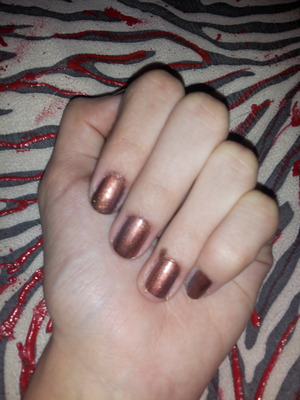 I have been looking for a cheap brown nail polish with a red tint in it. I found a DIY nail polish video today, so i tried it out. My phone camera sucks, but I'm going to try a picture anyways. Ideas or comments? My hand looks weird, i just stopped biting my nails haha.