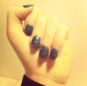 Nails with black balls.