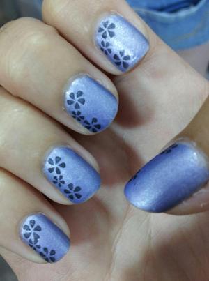 Quicky stamping manicure.

For this design I used:

Revlon Scented Nail Colour- Not So Blueberry (base)
Sally Hansen Xtreme Wear- Black Out (flowers)
NYC- Matte Me Crazy Topcoat