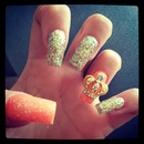 Orange & gold glitter crown nails