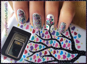 I used Sinful Colors .:. Snow Me White as the base and then I added different colors of nail foil on top in different spots (Besides Ring). I then stamped BM-201 on top of the foil with Finger Paints .:. Black Expressionism. For the Ring finger, I used Finger Paints .:. Black Expressionism for the tree and added hearts in Sinful Colors .:. Rise and Shine, Sinful Colors .:. Verbena, L’oreal .:. Pink Me Up 280, and L’oreal .:. Now You Sea Me 530
