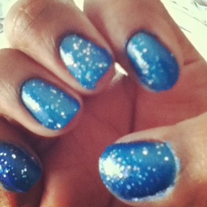 I love this neon blue color. Its a China Glaze  Blue Sparrow (neon) you can find it at your Local Sally's<3 but I have to say im not happy with it. It didnt even last through the night! I went swimming and Its was coming off. Sad...Btw The Glitter on top but a top coat of just clear and sliver giltter.
