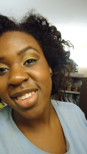 Neutrals & yellow on lid with aqua glitter on lower lash line