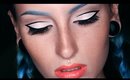 Graphic black eyeliner with blue eyebrows and glitter makeup tutorial