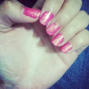 Pink nail polish and clear glitter 