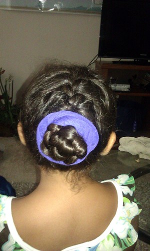 Use bobby pins after twisting the bun around to keep it in tact.