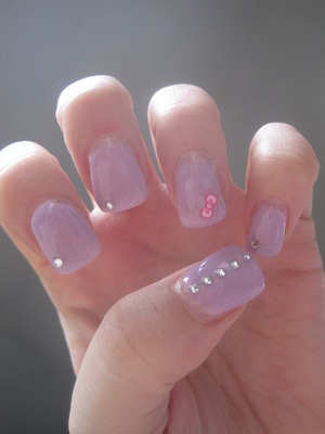 Lilac gel with silver rhinestones and little pink fimo bow slice