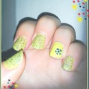 Yellow nails with blue glitter