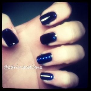 Midnight blue nails with electric blue crystals. 