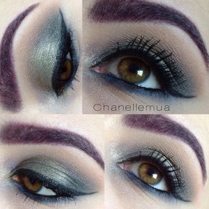 Green eyeshadow using green, gray, violet, and blues'