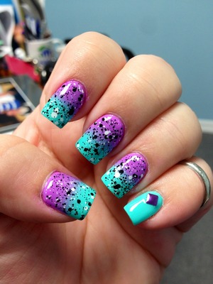 Sponged on China Glaze That's Shore Bright and Too Yacht To Handle then used Maybelline Polka Dots Clearly Spotted as a topcoat. The purple stud is from dollarnailart.com