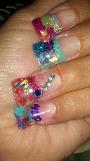 Colorful glitter nails done with gel