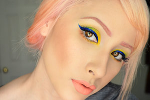 used: buttercupcake, acidberry, flamepoint on the eyes, mixed royal sugar with a mixing medium to create the wing liner, and used supercharged on the brows! All from Sugarpill and then on the lips I have on summer by Melt Cosmetics