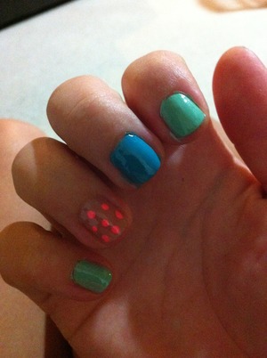 Blue, green, nude and pink spots perfect for a spring or summer manicure.