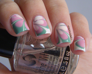http://thepolishwell.blogspot.com/2013/01/nail-ideas-vintage-retro-water-marble.html