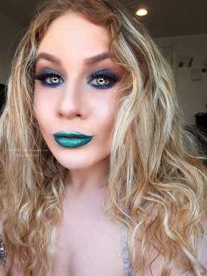 Yes, at first glance this is VERY vibrant and dramatic but why flow with the crowd?  One thing to keep in mind if you replicate this look (you can make the lips a pale nude, both work) is paper towels are needed, tons of glitter fall out will occur especially since my lower lash line is full of glitter!  Hopefully you guy's enjoy a switch up in looks ;) http://theyeballqueen.blogspot.com/2016/03/teal-glittery-peacock-spring-makeup.html