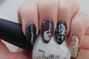 The polishes used in this manicure are all from Hard Candy, except the black on the ring finger which is Maybelline Color Show Onyx Rush. I then used a stamping plate for the elephant.
Polishes used listed from left to right: Hard Candy Bite of Black, Hard Candy Just Dance & Hard Candy Celebrate Sequins. 