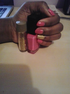 pink nail polish with a golden glitter