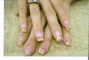 acrylic nails with confetti tips added in the acrylic.