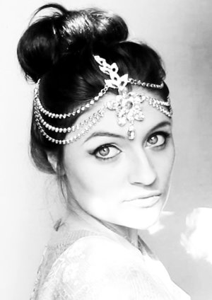 Ideas for an evening. Classic makeup with bun accessoried to jewelries