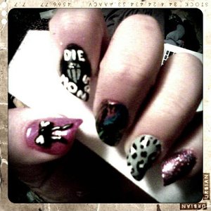 thumb is pink with 3d black acrylic bow, pointer is inspired by a T. Mills song, middle is neon splatter covered in crackle polish, ring is leopard print, and pinky is rockstar pink glitter. 