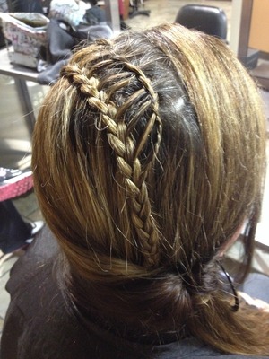 A ladder braid going into a flipped ponytail.