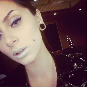 Holographic glitter on brows & lips as well as a blue liner over my black, winged liner.