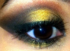 Pop of gold packed onto upper lid and lower lashline