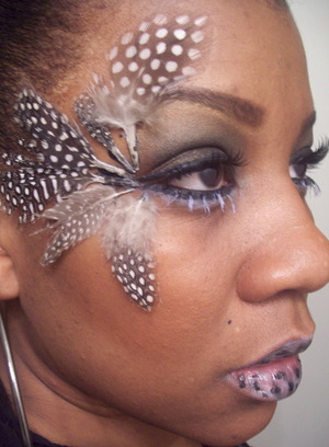 Feathers glued on with white lashes to create a dramatic look