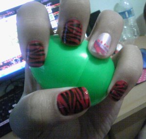 This is one of my first designs. I was obsessed with zebra prints so I did them on my nails. This was also the first time I had the tips squares.