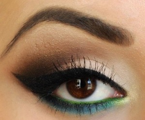 Mixture of smokey on top eyelid and subtle yellow and aqua green at bottom 