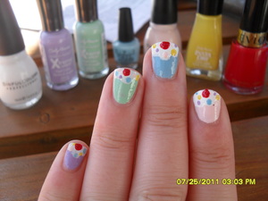 Cupcake inspired nails I learned from Miss Glamorazzi! 
Purple- Sally Hansen Xtreme Wear "Lacey Lilac"
Green- Sally Hansen Xtreme Wear "Mint Sorbet"
Blue- OPI "Whats with the Cattitude?"
Pink- Sinful Colors "Easy Going"
