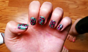 teal and pink leopard nails.