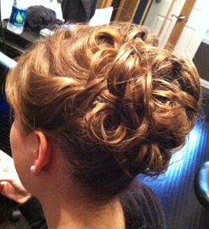 Loosely curled style pulled back with Bobbi pins. 





