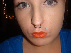 Orange lips, neutral eyes