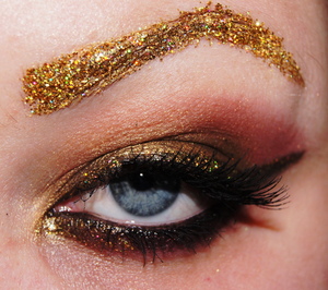 Gold glitter brows.