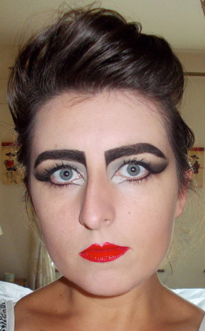 I love Siouxsie Sioux and am influenced by her style and makeup. This look is inspired by the Style Me Vintage Makeup book by Katie Reynolds.