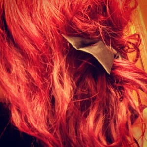 red hair and black bow a la the little mermaid. 