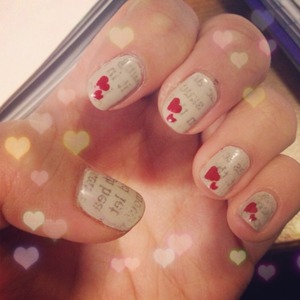 Newspaper nails with hearts in the corner