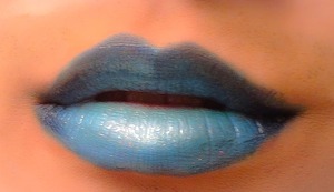A galaxy inspired blue lip using eyes shadows and lots of lip balm as a mixing medium