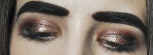 Eyes
Maybelline Color Tattoo 24Hr Eyeshadow in Bad to the Bronze
MAC Mineralize Eyeshadow in Gilt by Association
Chanel Illusion d'Ombre Eyeshadow in Mirifique
Detrivore Cosmetics eyeshadow in Hemoglobin
Coastal Scents Hot Pots in Chamois Nude
Givenchy Eye Fly Mascara in Black

More info here: http://bit.ly/SJbvdh