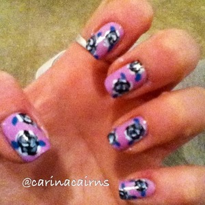 Lilac nail polish with black and grey floral design. All done by hand with a small nail art brush. 