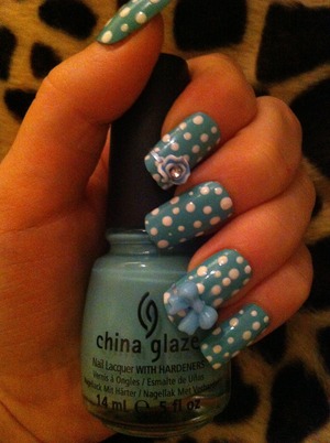 I used china glaze nail varnish and Rimmel top coat to seal the design in with. A dotting tool dipped in white nail varnish to get the dots and 3D nail art (bow and rose) to make it more unique which I glued on with nail glue :D tell me what you think.