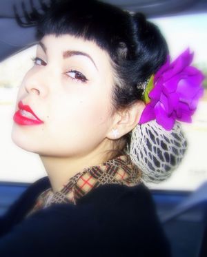 Love wearing my vintage 1940's hair snood with a hair flower and red lips.