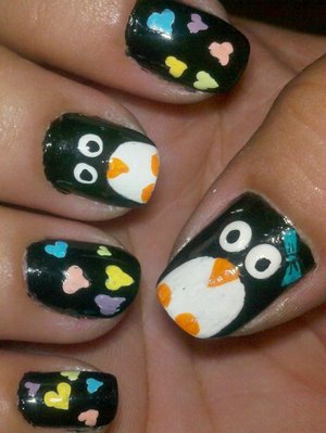 i used maybelline express finish in onyx rush & then used acrylic paints to draw the hearts & penguins. i topped it off with a top coat :)