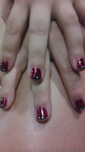 tiny ladybugs...I practiced on my daughters nails