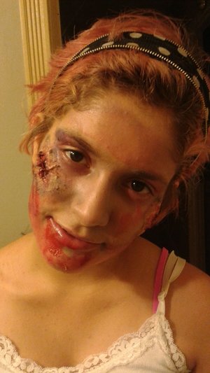My first attempt at a zombie look. I used liquid latex and tissue paper and opened it with a tweezer to get the cut skin.