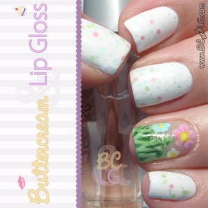 Perfect for spring.  Used a white base and pastel glitter polish and painted grass and pastel flowers on the ring finger.  Details and be found on the blog: http://www.buttercreamandlipgloss.com/2014/03/notw-spring-flowers.html