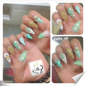 Glitter stiletto nails with a gold crown and roses patern